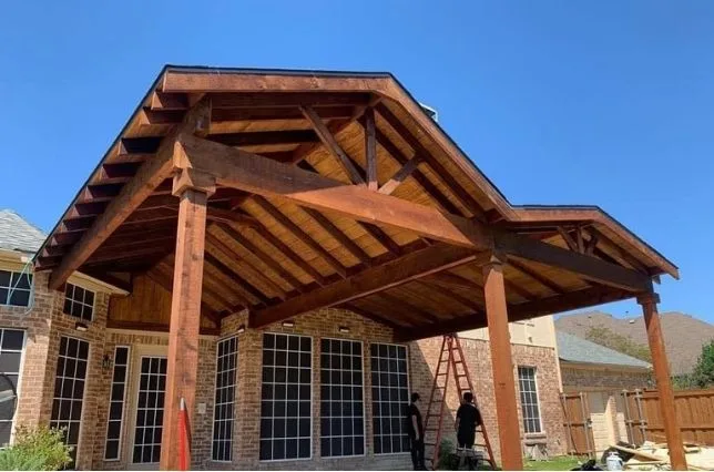 Stained timber patio cover framed and roofed by the Shoemaker Snoddy construction crew